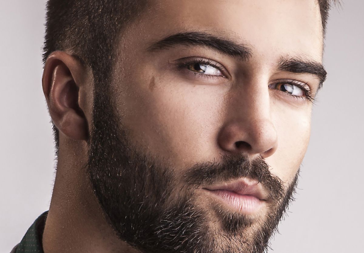 Close-up portrait of a man with a beard.